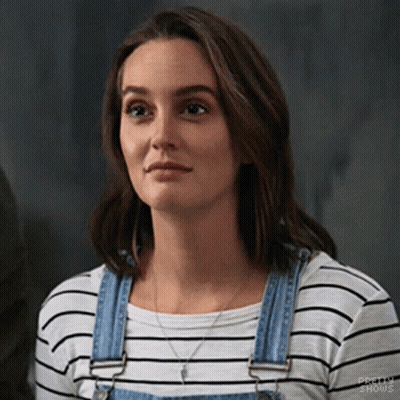 Woman In Striped Shirt And Overalls Looking GIF