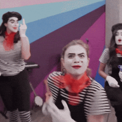 Woman In Striped Shirt And Red Scarf Making Funny Face GIF