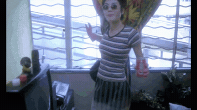 Woman In Striped Shirt Holding Coca Cola Can GIF