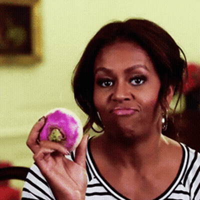 Woman In Striped Shirt Holding Pink Donut GIF