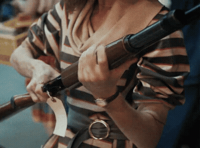 Woman In Striped Shirt Holding Telescope GIF