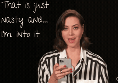 Woman In Striped Shirt Looking At Phone GIF