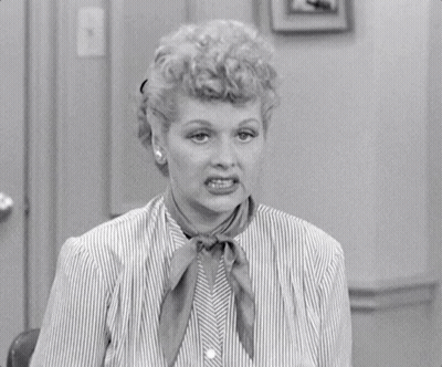 Woman In Striped Shirt Making Funny Face GIF