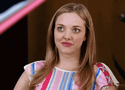 Woman In Striped Shirt Making Funny Face GIF