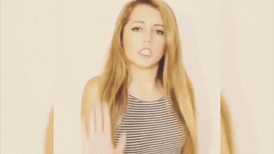 Woman In Striped Shirt Making Heart With Hands GIF