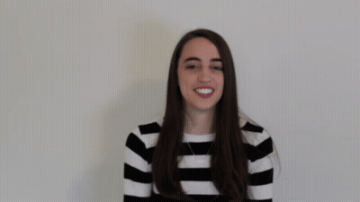 Woman In Striped Shirt Saying Love GIF