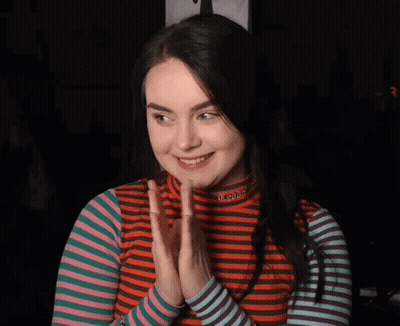Woman In Striped Shirt Saying Utopia GIF