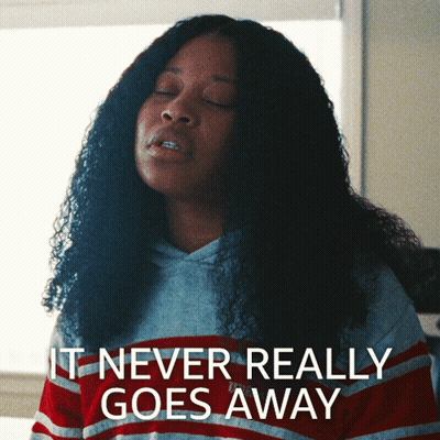 Woman In Striped Shirt Says It Never Really Goes Away GIF