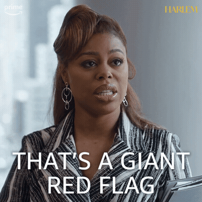 Woman In Striped Suit Saying That's A Giant Red Flag GIF