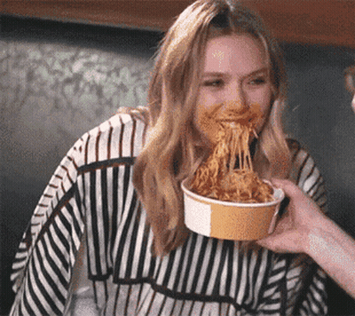 Woman In Striped Sweater Eating Spaghetti GIF