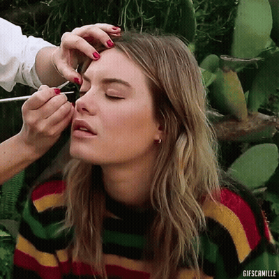 Woman In Striped Sweater Getting Eyebrows Done GIF