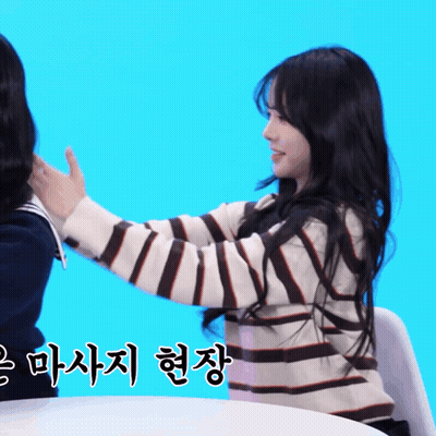 Woman In Striped Sweater Holding Another Woman's Hand GIF