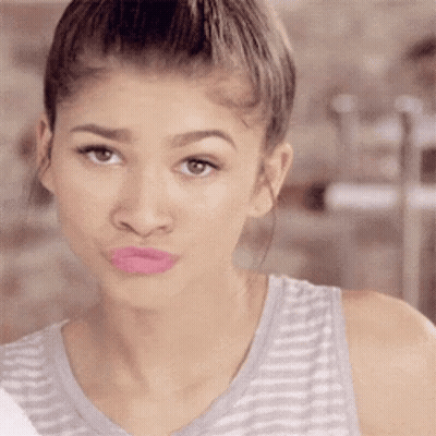Woman In Striped Tank Top Making Face GIF