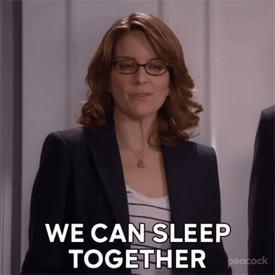 Woman In Suit And Glasses Says We Can Sleep Together GIF
