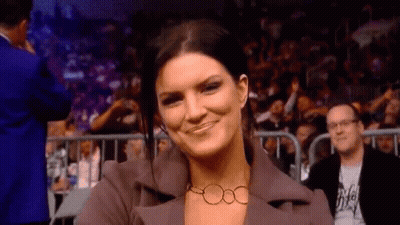 Woman In Suit And Necklace Smiling GIF