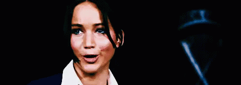Woman In Suit And Tie Funny Face Pointing At Camera GIF