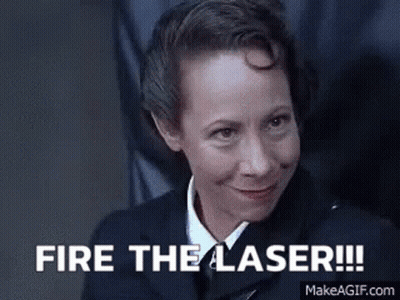 Woman In Suit And Tie Saying Fire The Laser GIF