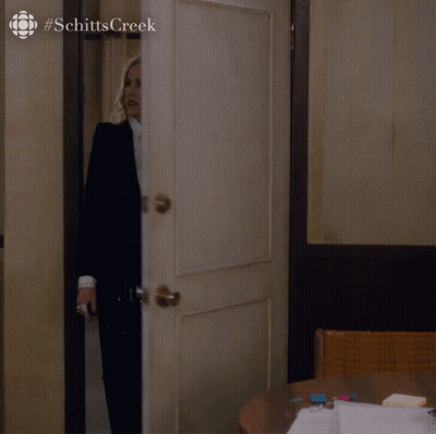 Woman In Suit And Tie Standing In Doorway #SchittsCreek GIF