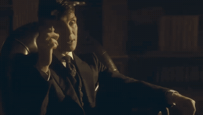 Woman In Suit And Tie Talking To Another Woman GIF