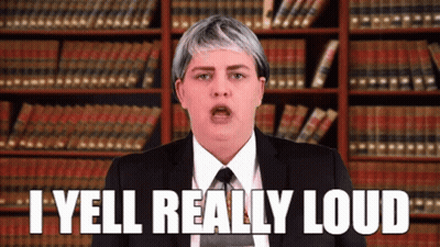 Woman In Suit And Tie Yelling GIF