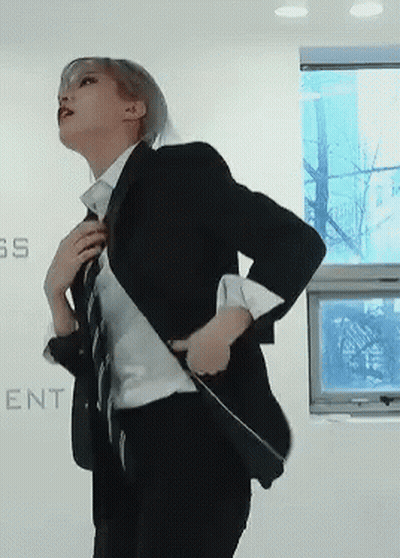 Woman In Suit Beside Wall Saying SS GIF