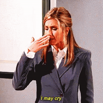 Woman In Suit Covering Mouth Saying I May Cry GIF
