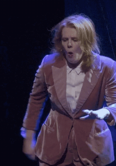 Woman In Suit Dancing On Stage GIF