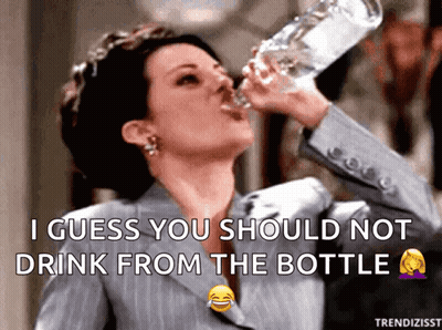 Woman In Suit Drinking Bottle Caption I Guess You Should Not Drink From Bottle GIF