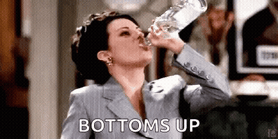 Woman In Suit Drinking Bottle Of Water GIF