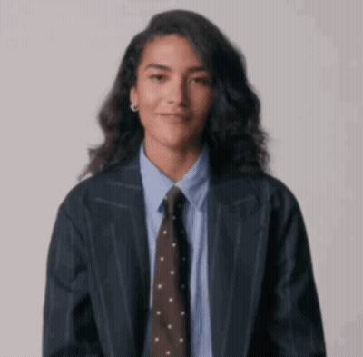 Woman In Suit Giving Middle Finger GIF