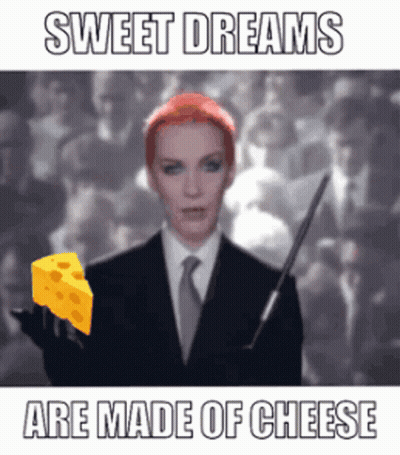 Woman In Suit Holding Cheese Sweet Dreams Are Made Of Cheese GIF