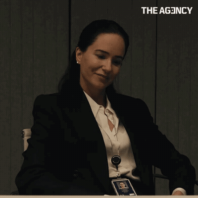 Woman In Suit Laughing Saying I Told You GIF