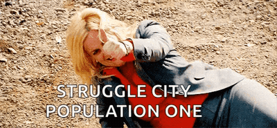 Woman In Suit Laying On Ground Struggle City Population One GIF