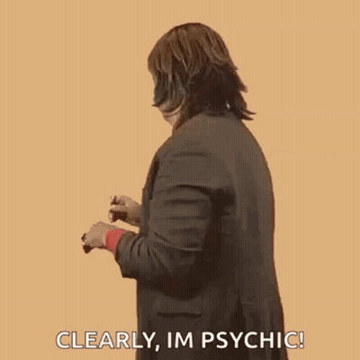 Woman In Suit Making Funny Face Saying Im Psychic GIF