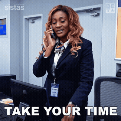 Woman In Suit On Cell Phone Take Your Time GIF