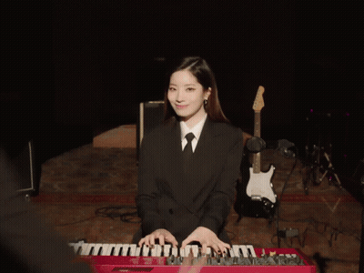 Woman In Suit Playing Keyboard GIF