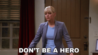 Woman In Suit Saying Don't Be A Hero GIF