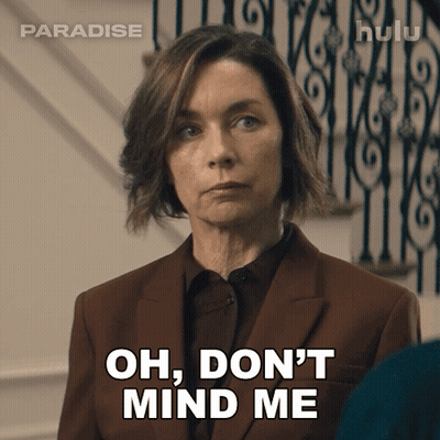 Woman In Suit Saying Oh Don't Mind Me In Front Of Staircase GIF