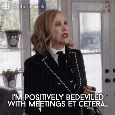 Woman In Suit Saying Positively Bedeviled With Meetings Et Cetera GIF