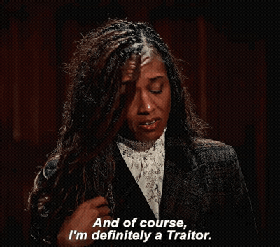 Woman In Suit Says Being A Traitor GIF