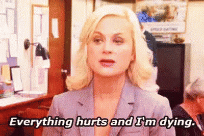Woman In Suit Says Everything Hurts And I'm Dying GIF