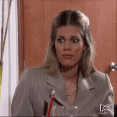 Woman In Suit Sitting At Desk With Pencil And Water GIF
