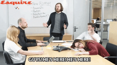 Woman In Suit Sitting In Front Of Meetings Suck Sign GIF