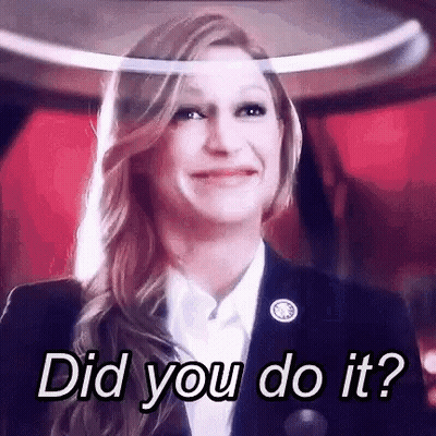 Woman In Suit Smiling Asking Did You Do It GIF