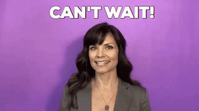 Woman In Suit Smiling Saying Cant Wait GIF