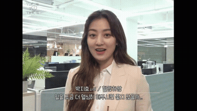 Woman In Suit Standing In Office GIF