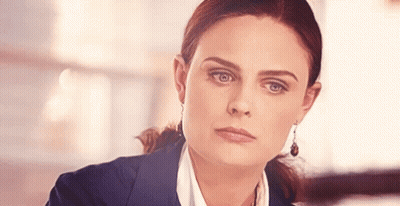 Woman In Suit With Earrings GIF