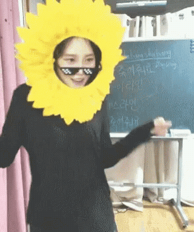 Woman In Sunflower Hat And Sunglasses At Blackboard Saying Shopping GIF