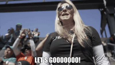 Woman In Sunglasses And Black Shirt Says Let's Gooooooo GIF