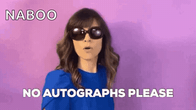 Woman In Sunglasses And Blue Shirt Saying No Autographs Please GIF